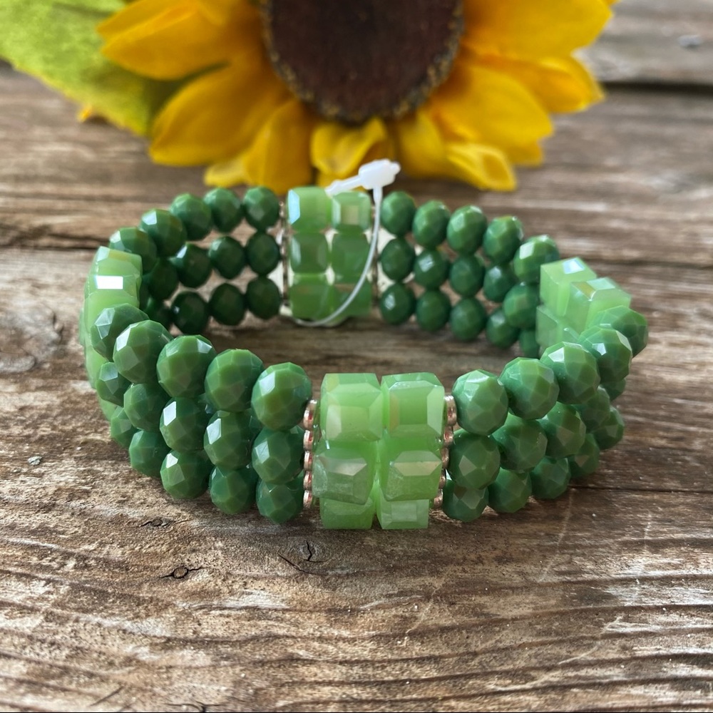 Green stretchy bracelet with crystal beads.